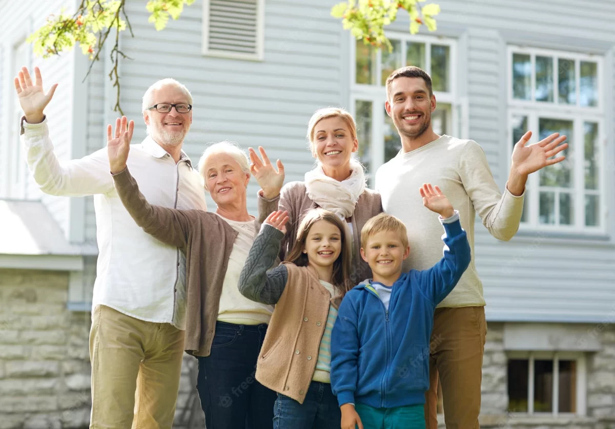 family standing infront of building in Kerala built by chothys builders